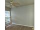 Bedroom with wood floors, ceiling fan, and a window at 10539 Egret Haven Ln, Riverview, FL 33578