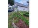Landscaped garden bed with colorful flowers in front of a well-maintained home at 10539 Egret Haven Ln, Riverview, FL 33578