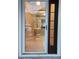 Inviting front door with decorative glass, screen door, and security system at 10539 Egret Haven Ln, Riverview, FL 33578