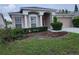 Charming single-story home featuring a well-manicured lawn and a two-car garage at 10539 Egret Haven Ln, Riverview, FL 33578