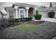 Charming single-story home featuring a well-manicured lawn and a two-car garage at 10539 Egret Haven Ln, Riverview, FL 33578