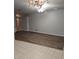 Open-concept living room with wood floors and neutral paint provides a bright and spacious area at 10539 Egret Haven Ln, Riverview, FL 33578