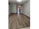 Spacious living room featuring wood floors and a neutral color palette offers a versatile living space at 10539 Egret Haven Ln, Riverview, FL 33578