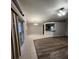 Open-concept living space showcasing a blend of tile and wood flooring at 10539 Egret Haven Ln, Riverview, FL 33578