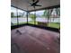 Screened-in patio with ceiling fan overlooking spacious fenced yard with hot tub at 10539 Egret Haven Ln, Riverview, FL 33578