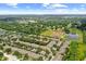 Panoramic aerial view showcasing a residential community with natural ponds and landscaping at 10947 Brickside Ct, Riverview, FL 33579