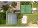 Aerial view of community amenities, including a playground, tennis, and basketball courts at 10947 Brickside Ct, Riverview, FL 33579