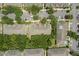 Aerial view of a residential community featuring lush greenery and ample parking at 10947 Brickside Ct, Riverview, FL 33579