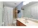 Bathroom featuring a tub/shower combo and a single sink vanity at 10947 Brickside Ct, Riverview, FL 33579