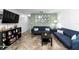 Inviting living room featuring comfortable sofas, a stylish coffee table, and modern decor at 10947 Brickside Ct, Riverview, FL 33579