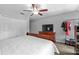 Main bedroom with closet, ceiling fan, and dresser at 10947 Brickside Ct, Riverview, FL 33579