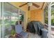 Outdoor patio with chair, fan, and sliding glass doors; an inviting spot to relax at 10947 Brickside Ct, Riverview, FL 33579