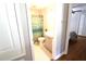 Cozy bathroom featuring a shower with blue curtain and neutral color scheme at 1103 E Lambright St, Tampa, FL 33604