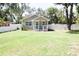 Charming single-story home featuring a well-maintained lawn and inviting front porch at 1103 E Lambright St, Tampa, FL 33604