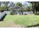 Charming single-story home featuring a well-maintained lawn and inviting front porch at 1103 E Lambright St, Tampa, FL 33604