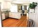 Bright kitchen featuring stainless appliances, granite counters and open layout to dining area at 1103 E Lambright St, Tampa, FL 33604