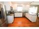 Modern kitchen featuring stainless steel appliances, granite countertops, and white cabinetry at 1103 E Lambright St, Tampa, FL 33604