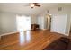 Large living room features hardwood floors, access to the patio, and three closets at 1103 E Lambright St, Tampa, FL 33604