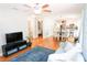 Spacious living area with hardwood floors, open layout, and contemporary decor at 1103 E Lambright St, Tampa, FL 33604