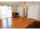 Spacious living room features hardwood floors, multiple closets, and patio door at 1103 E Lambright St, Tampa, FL 33604