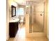 Bathroom featuring a glass door shower and modern vanity at 111 12Th Ave, Indian Rocks Beach, FL 33785