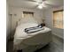 Bedroom with a queen-sized bed, a side table and natural lighting at 111 12Th Ave, Indian Rocks Beach, FL 33785