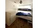 Small bedroom featuring a bunk bed and dresser at 111 12Th Ave, Indian Rocks Beach, FL 33785
