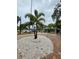 Charming home with lush landscaping and a circular driveway enhancing curb appeal at 111 12Th Ave, Indian Rocks Beach, FL 33785