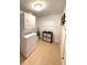 Clean laundry area with stackable washer and dryer and storage at 111 12Th Ave, Indian Rocks Beach, FL 33785