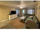Inviting living room with comfortable seating, television, and plenty of natural light at 111 12Th Ave, Indian Rocks Beach, FL 33785