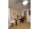 Bright office space with desk, chair, a tiled floor, and a small table at 111 12Th Ave, Indian Rocks Beach, FL 33785