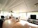 Inviting sunroom with tile flooring, ceiling fan, and plenty of natural light creating a peaceful atmosphere at 111 12Th Ave, Indian Rocks Beach, FL 33785