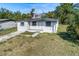 Charming single-story home featuring a well-maintained front yard and classic architectural details at 111 W Keyes Ave, Tampa, FL 33602