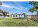 A clean home with a well-maintained lawn and a bright blue sky at 111 W Keyes Ave, Tampa, FL 33602