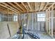 Interior of a room showing the exposed framework and concrete block walls ready for finishing at 111 W Keyes Ave, Tampa, FL 33602