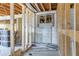 An interior under construction showing a block wall, rough framing, and an opening for a future room at 111 W Keyes Ave, Tampa, FL 33602