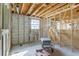 Unfinished room featuring concrete walls, framework, and windows, showcasing the potential for customization at 111 W Keyes Ave, Tampa, FL 33602