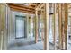 Interior of a room with exposed framework and concrete block walls, ready for renovation at 111 W Keyes Ave, Tampa, FL 33602