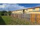 Fenced backyard features lush grass near the apartment building at 1120 Union S St, St Petersburg, FL 33712