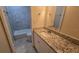 Bathroom featuring vanity with granite counters, framed mirror and updated fixtures at 1120 Union S St, St Petersburg, FL 33712
