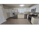 Modern kitchen featuring stainless steel appliances, granite counters, and white cabinets at 1120 Union S St, St Petersburg, FL 33712