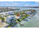 Waterfront property showcasing lush landscaping and easy access to the water at 11240 6Th E St, Treasure Island, FL 33706