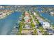 Aerial view of the home in a waterfront community with a private dock at 11240 6Th E St, Treasure Island, FL 33706