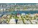 Waterfront home featuring a private dock and well-manicured landscaping at 11240 6Th E St, Treasure Island, FL 33706