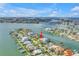 Waterfront home located on a canal featuring lush landscaping and ocean views at 11240 6Th E St, Treasure Island, FL 33706