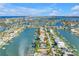 Waterfront home featuring lush landscaping and beautiful water views at 11240 6Th E St, Treasure Island, FL 33706