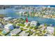 Beautiful waterfront home with lush landscaping, private dock, and stunning views of the bay at 11240 6Th E St, Treasure Island, FL 33706