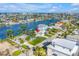 Desirable waterfront property with a private dock and lush landscaping, complemented by picturesque water views at 11240 6Th E St, Treasure Island, FL 33706