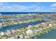 Waterfront home featuring tropical landscaping and beautiful bay views at 11240 6Th E St, Treasure Island, FL 33706