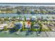 Waterfront home with a dock, swimming pool, lush landscaping, and serene water views at 11240 6Th E St, Treasure Island, FL 33706